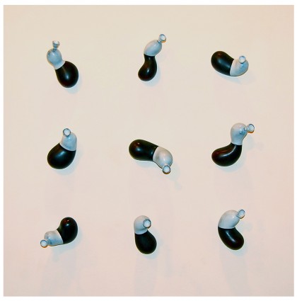 “Nine Black & White Balloons in a Square Grid”<br />20011<br />Polychrome Wood